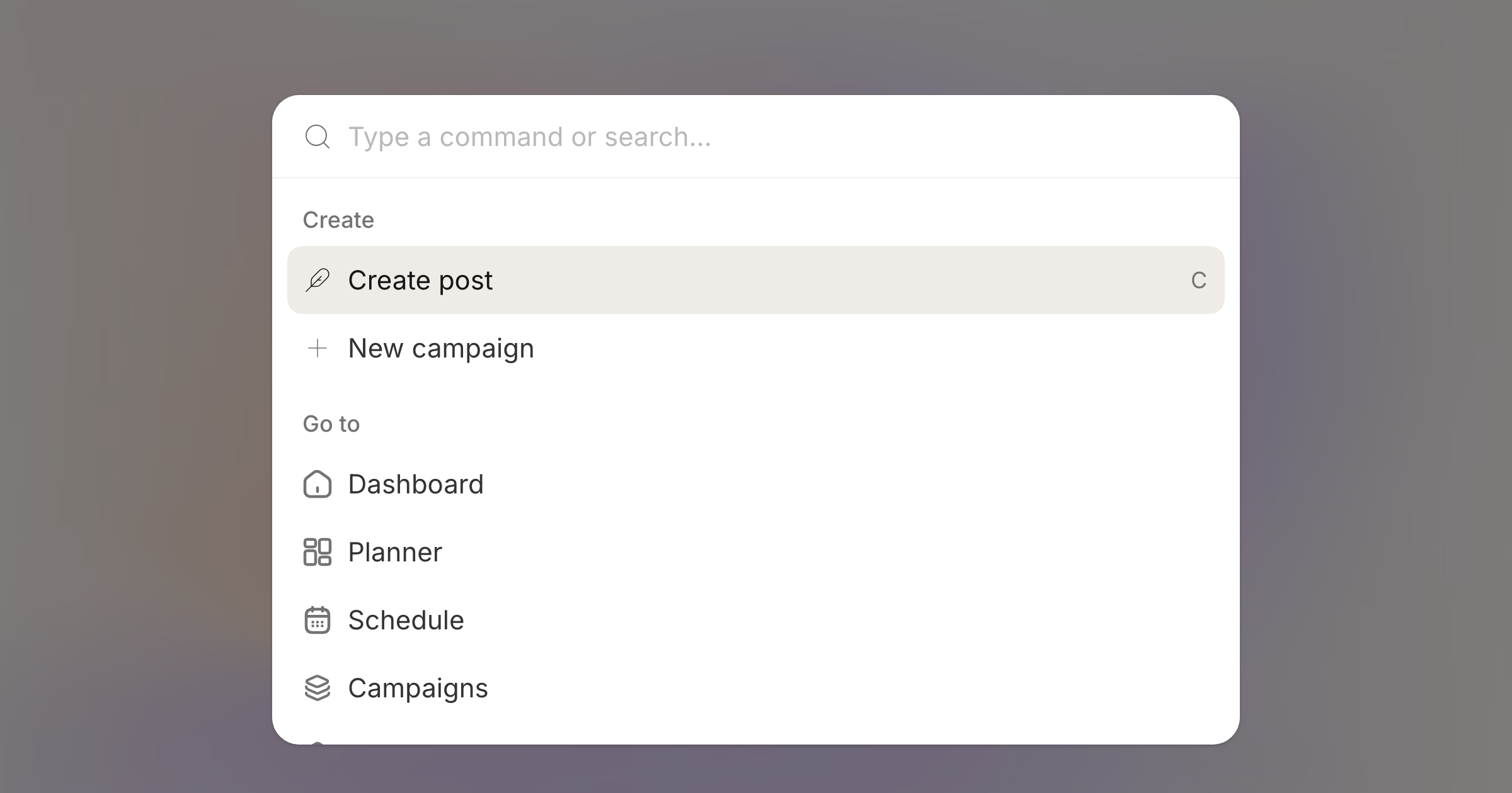The command menu open on its default groups, over a blurred workspace