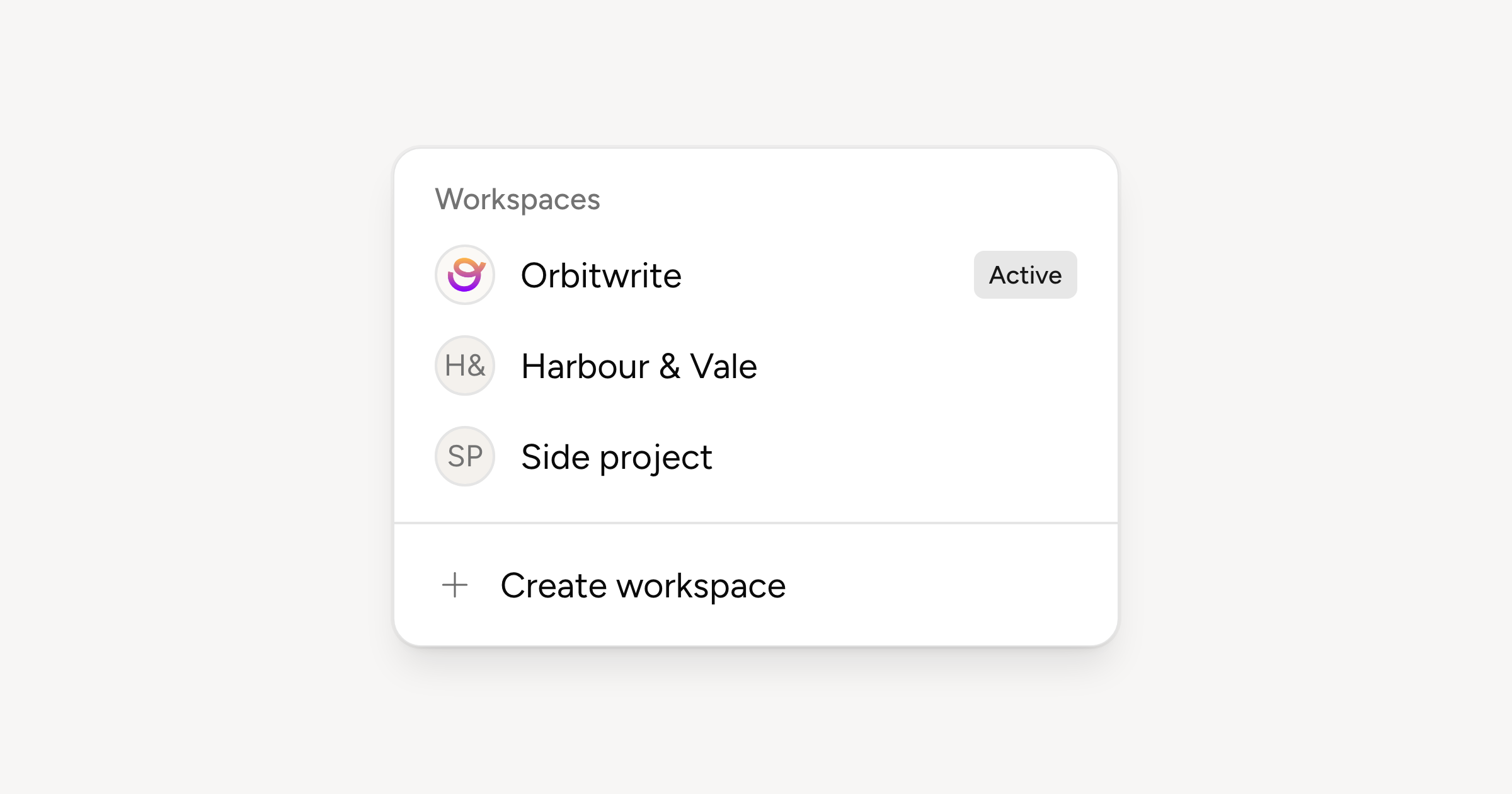 The workspace picker open, listing three workspaces and the button that creates another
